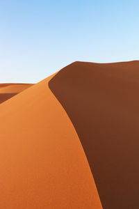 Scenic view of desert against clear sky