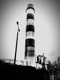 Low angle view of factory against clear sky