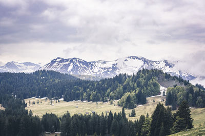 Scenic view of mountains against sky during winter