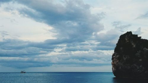 Scenic view of sea against cloudy sky