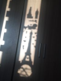 Shadow of text on wall