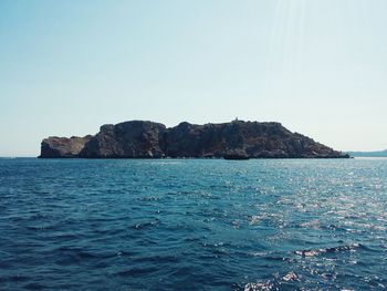 Scenic view of calm sea against clear sky