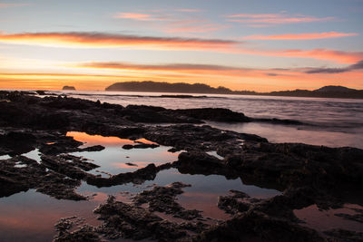 Scenic view of sea against sky during sunset