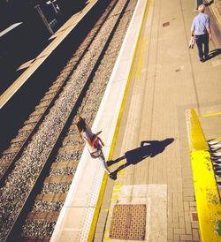 High angle view of people at railroad station