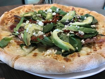 High angle view of pizza in plate on table