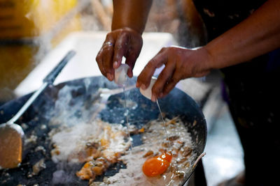 Close-up of person preparing food