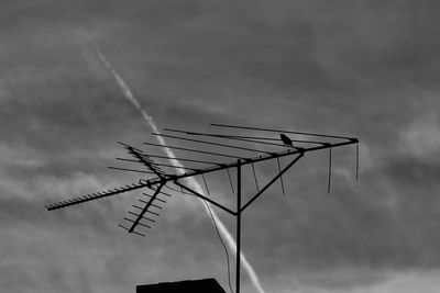 Low angle view of windmill against sky