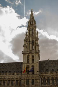 Low angle view of clock tower against sky