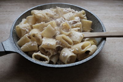 High angle view of pasta in saucepan on table