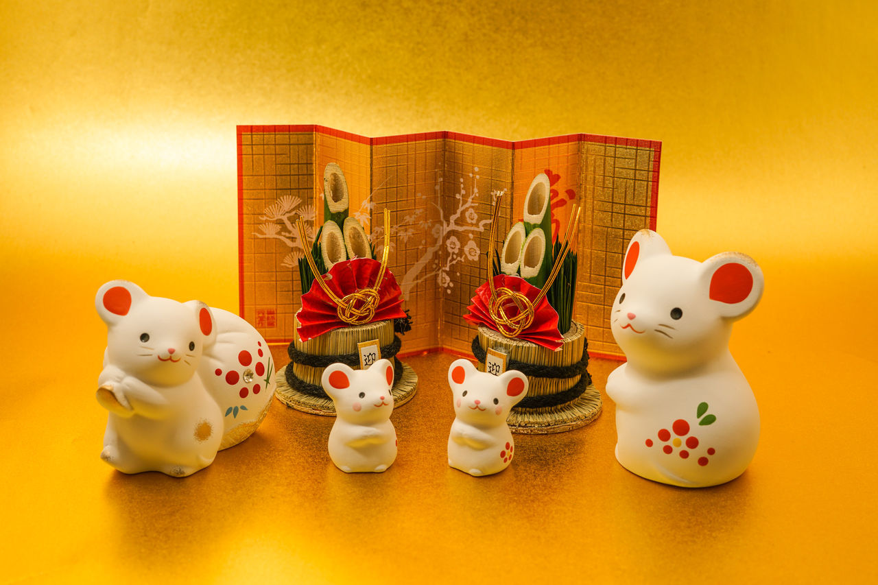 celebration, representation, mammal, holiday, animal representation, animal, no people, colored background, tradition, animal themes, decoration, indoors, food, figurine, toy, christmas, yellow, studio shot, cartoon, group of objects, domestic animals, human representation, event