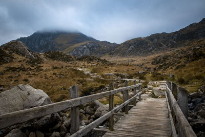 A bridge leading up to a welsh mountain trail 