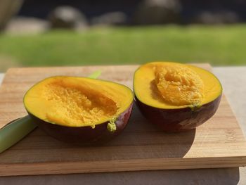 Close-up of orange slice on cutting board