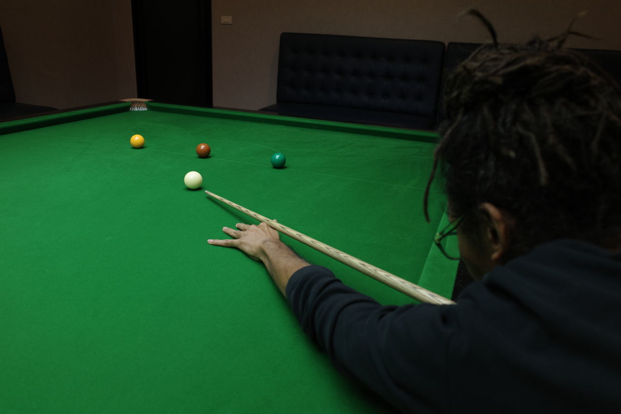 MAN PLAYING WITH BALL AND TABLE