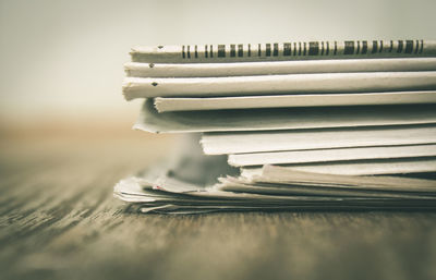 Stack of newspapers on table