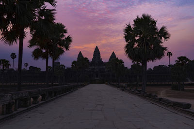 Panoramic view of trees and buildings against sky during sunset