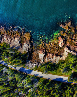 High angle view of rocks at seaside