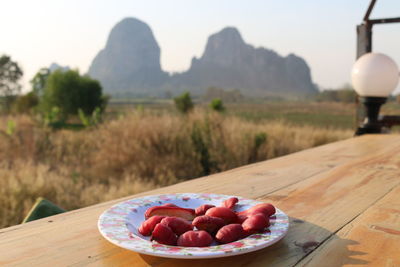 Fruits in bowl on table