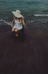 Two people relaxing on beach