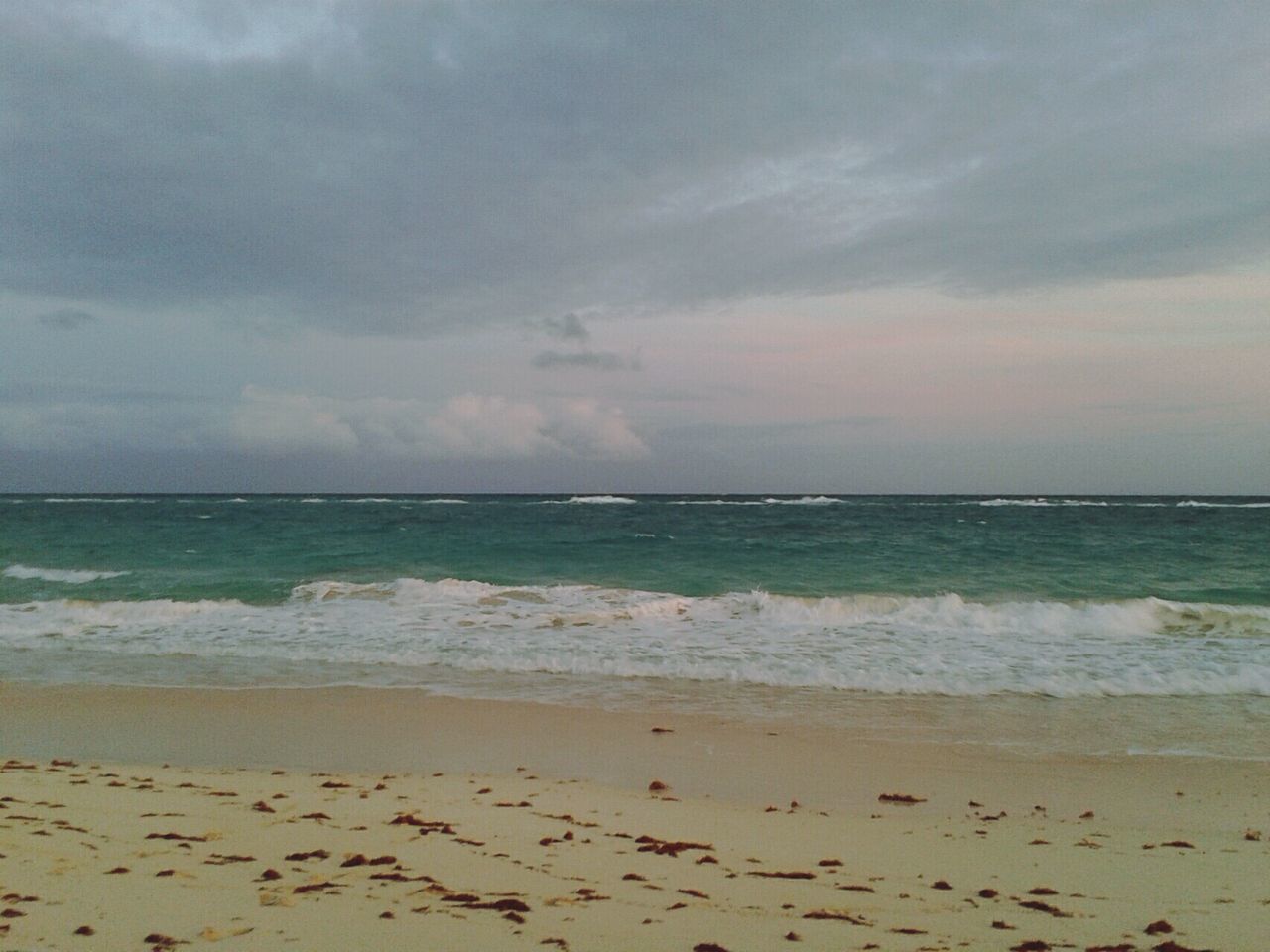 sea, horizon over water, beach, water, sky, shore, scenics, tranquil scene, tranquility, beauty in nature, cloud - sky, sand, nature, idyllic, cloudy, wave, cloud, sunset, coastline, remote