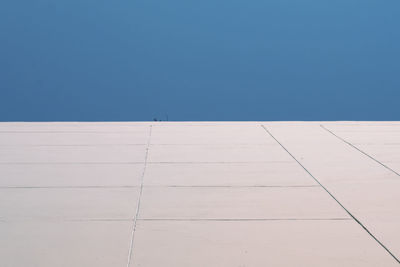 Low angle view of building against clear blue sky