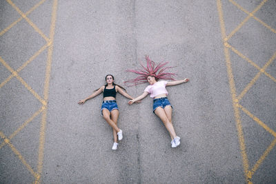 High angle view of two women walking on floor