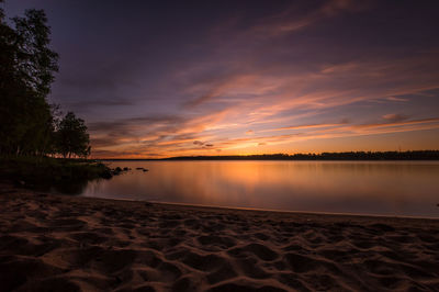 Scenic view of lake at dusk