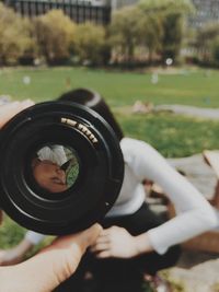 Close-up of photographer holding camera