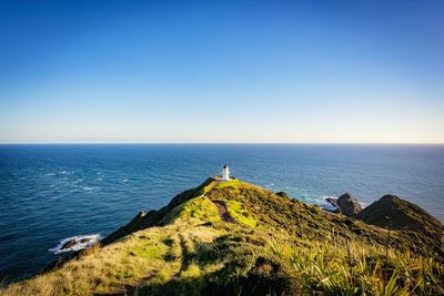 Scenic view of sea against clear blue sky