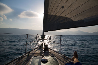 Boat sailing on sea against sky