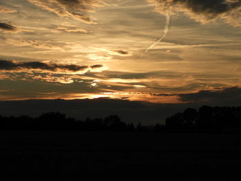 Scenic view of silhouette landscape against sky during sunset