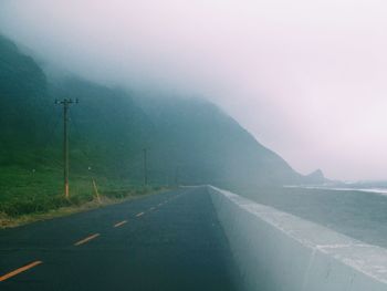 Empty road in foggy weather