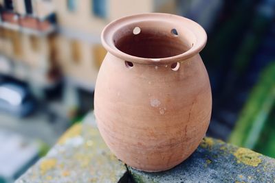 Close-up of old pot  on wall