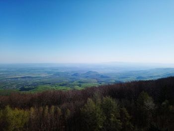 Scenic view of landscape against clear blue sky