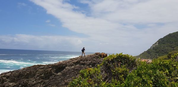 Man looking at sea against sky