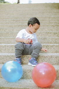 Boy playing with balloons