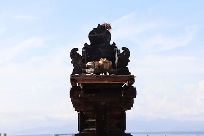 Low angle view of statue against sky