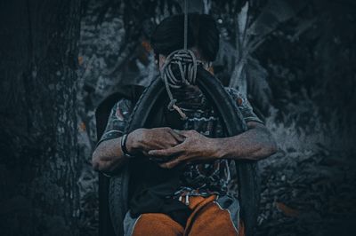 Man sitting in a forest