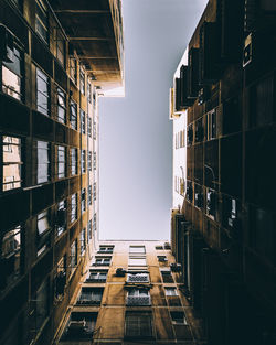 Low angle view of buildings against sky in city