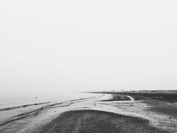 Scenic view of beach against clear sky