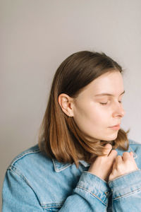 Portrait of a teenage girl over white background