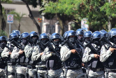 Group of army soldiers marching outdoors