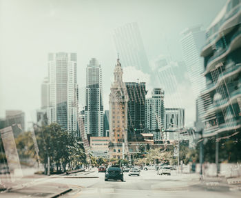 Modern buildings in city against sky