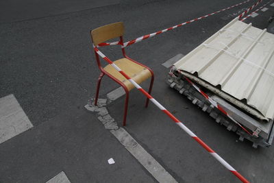 High angle view of chair on street 