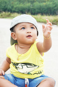 Portrait of cute boy looking away