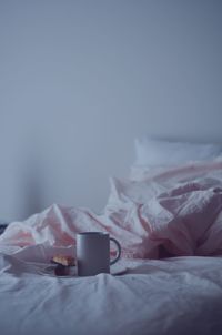 Cup on bed at home