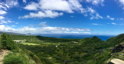 Scenic view of landscape and sea against sky