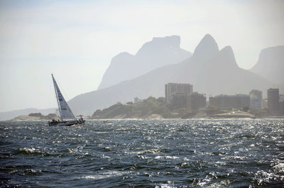 Sailboat sailing in sea