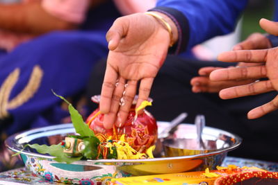 Midsection of people having food