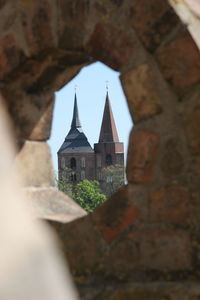 Low angle view of bell tower against sky