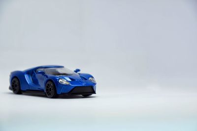 Close-up of toy car over white background